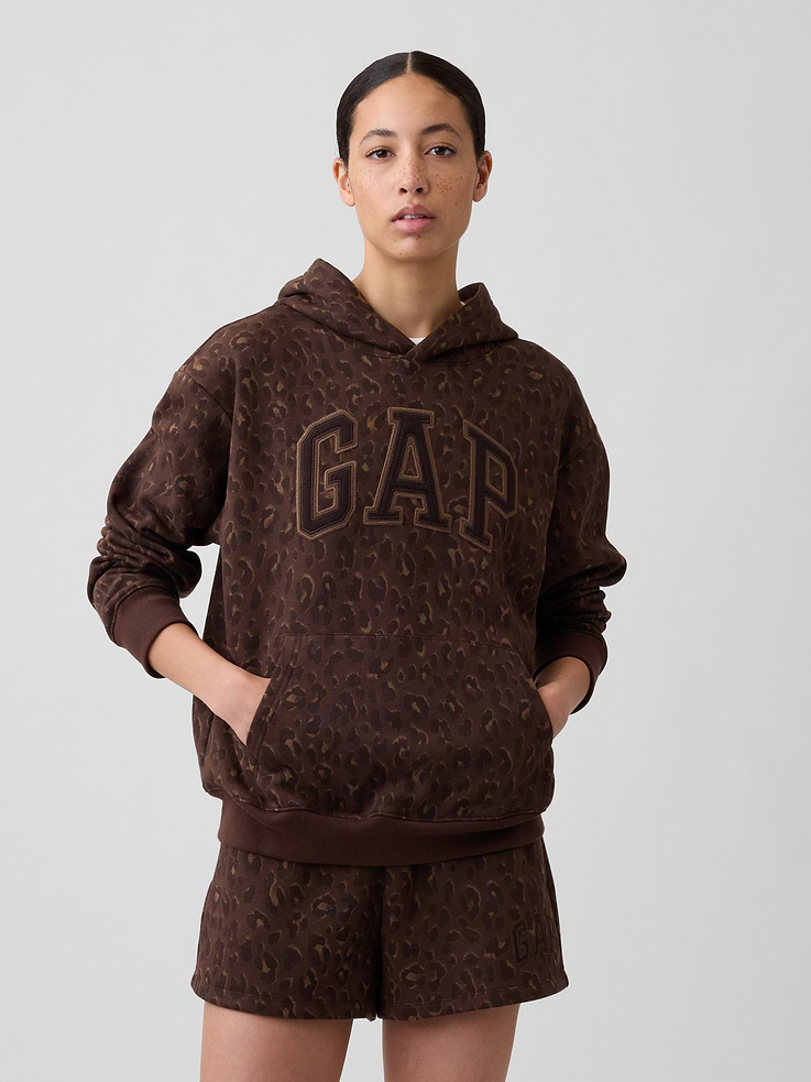 Image 1 of 5, This product is made with/contains 23% recycled polyester. Compared to virgin materials, using recycled materials helps reduce resource use and waste., Soft, comfy fleece., Dropped shoulder, long sleeves with banded cuffs., Drawcord ties at hood., Gap logo at front., Kanga pocket., Banded hem., Note: The dye used in the crafting of this product is prone to crocking, or color transfer. Please avoid contact with light-colored fabric or upholstery., Product #839432