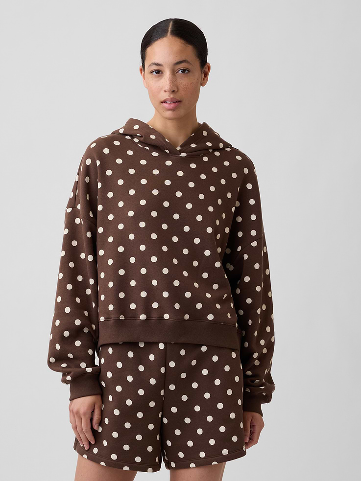 Image 1 of 5, Soft, comfy fleece., Dropped shoulder, long sleeves with banded cuffs., Hood., Gap logo at front., Banded hem., Note: The dye used in the crafting of this product is prone to crocking, or color transfer. Please avoid contact with light-colored fabric or upholstery., Product #430551