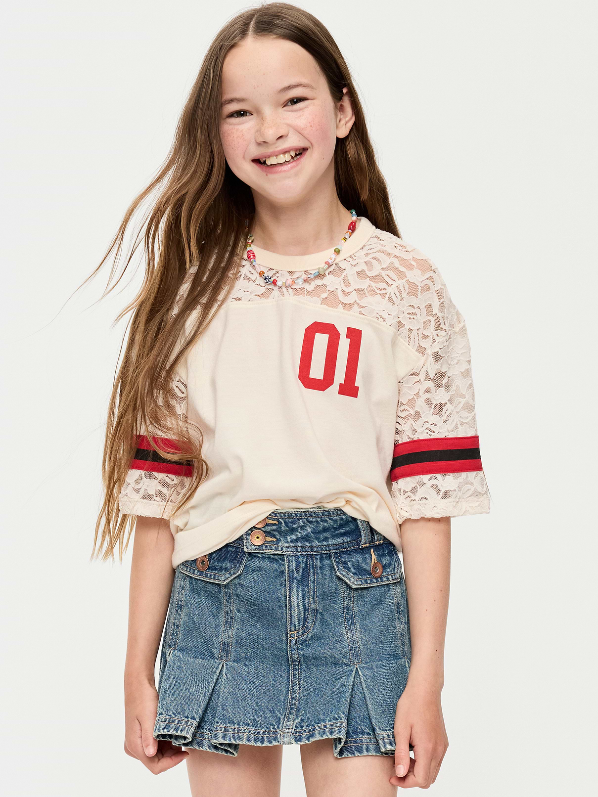 Image 1 of 2, crew neck, elbow length sleeves, drop shoulders, graphic at front, lace detail, Product #896735