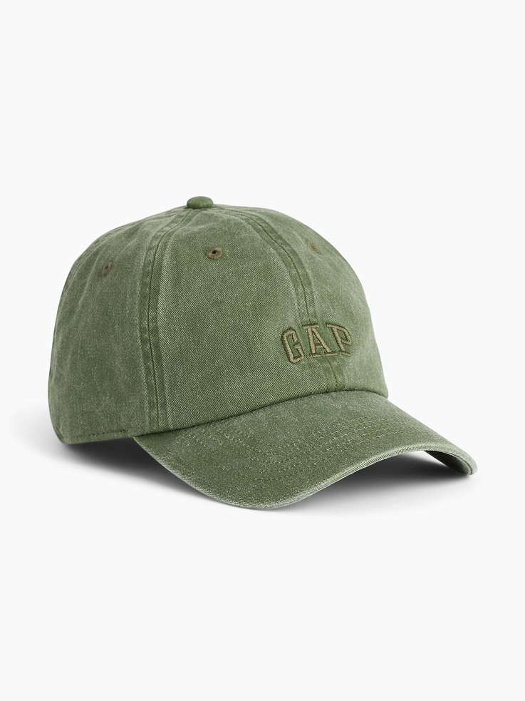 Image 1 of 3, Sturdy overdye twill cotton 6-panel baseball cap., Stitching at curved brim., Embroidered Gap logo at front., Adjustable strap with metal buckle closure at back., This product was made in a factory that invests in gender equity and women’s empowerment through RISE. Learn more at gapinc.com/equity ., Product #896724