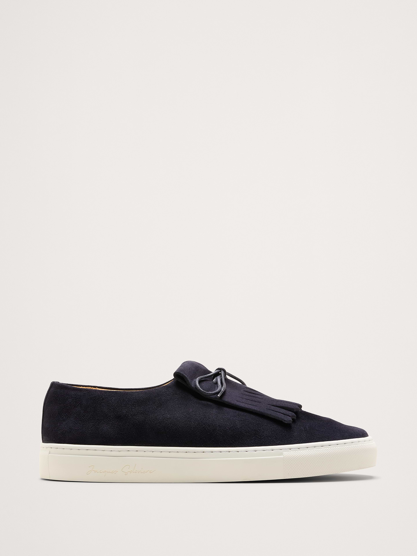 Image 1 of 5, A classic slip-on sneaker with pinched-tongue detail and thick, padded insoles., Jacques Solovière: Parisian footwear redefining timeless essentials with sculptural minimalism and exquisite craftsmanship since 2014., Italian suede uppers and leather lining., Rubber soles., Waxed laces., Made in Portugal., *This style runs 1/2 size large., Product #1182978