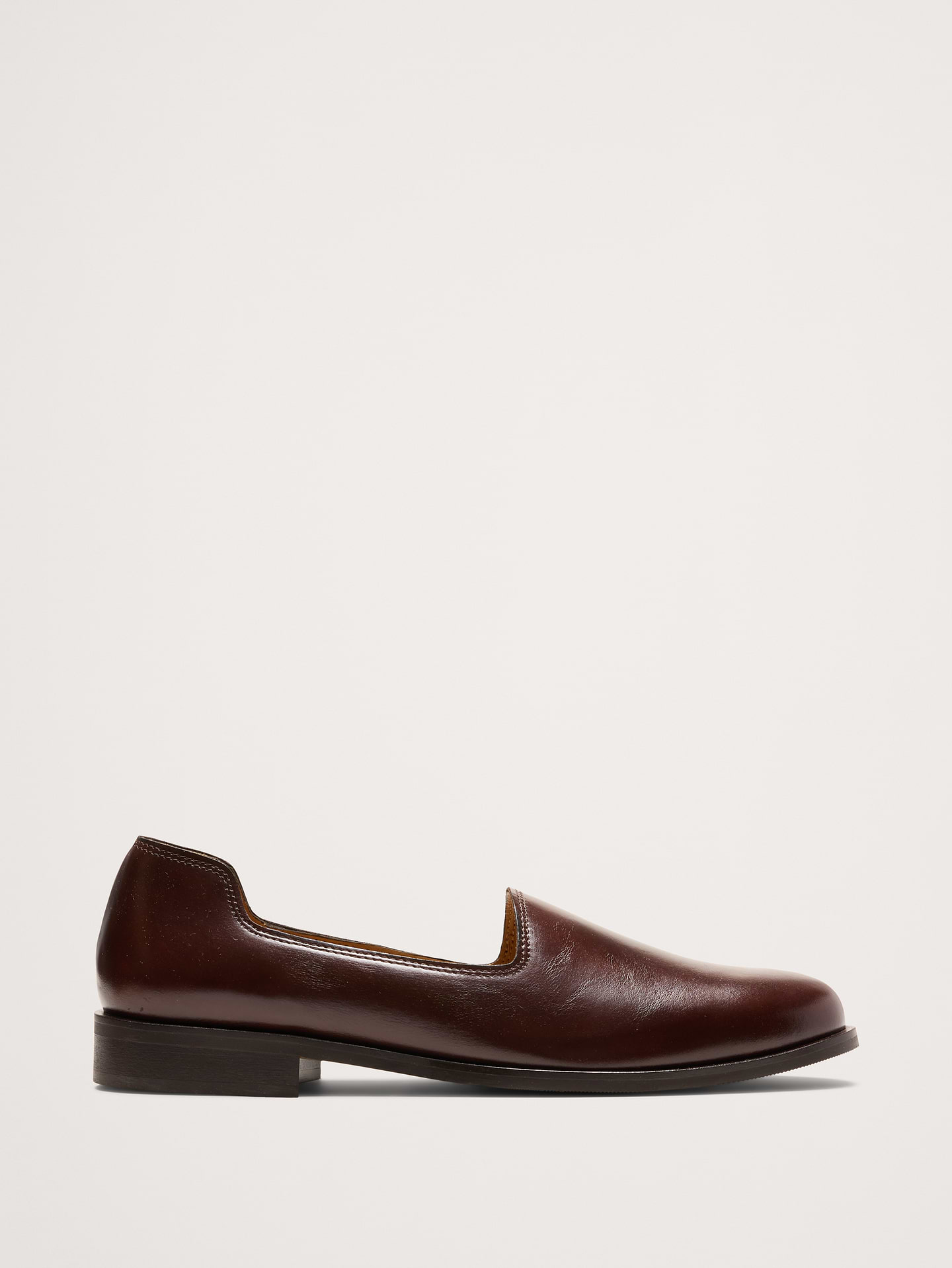 Image 1 of 6, A contemporary take on the classic loafer, this slipper-style uses a sharp, low-profile blending minimal design with everyday wearability. Handcrafted from preium Italian leather., Jacques Solovière: Parisian footwear redefining timeless essentials with sculptural minimalism and exquisite craftsmanship since 2014., Italian leather uppers and leather lining., Leather soles., Made in Portugal., *This style runs 1/2 size large., Product #1182980