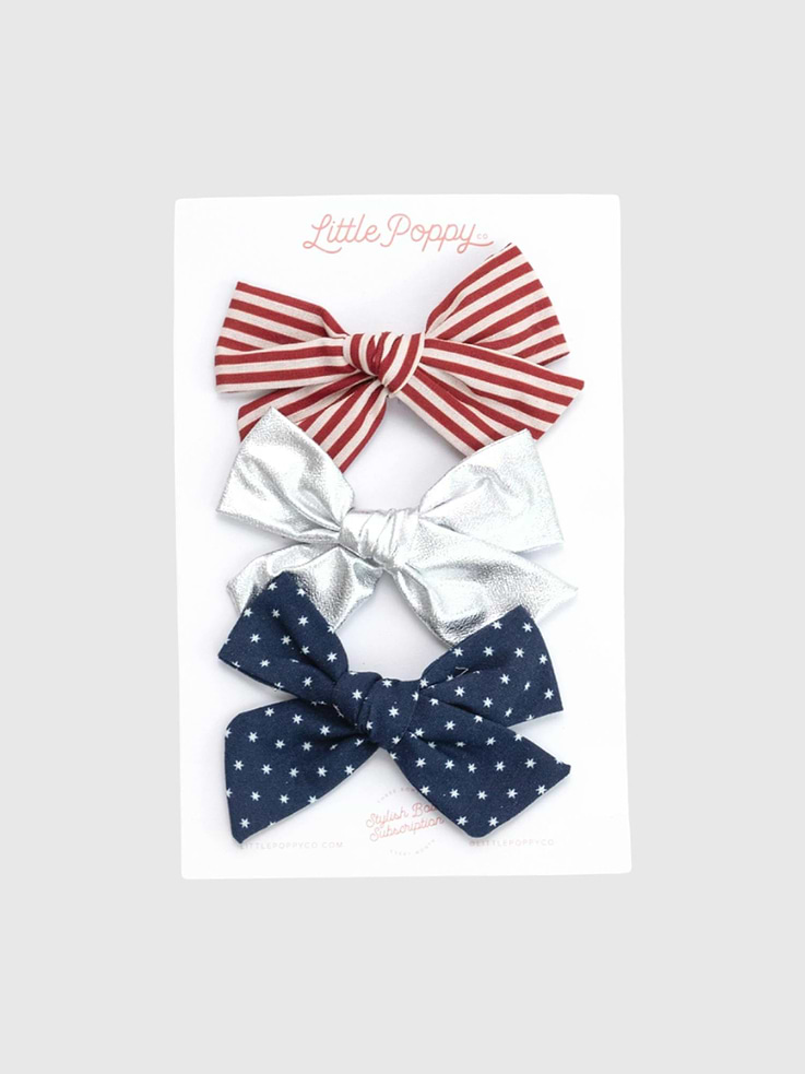 Image 1 of 7, The perfect 4th of July set that you will love all summer long., These cute prints are a must-have for the sunshine season., Bows come on alligator clips with a non-slip grip., Bows are reversible and can be reinserted onto the clip to be worn on either side of the head.