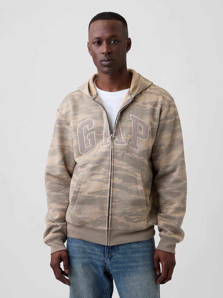 Image 1 of 4, This product is made with/contains 23% recycled polyester. Compared to virgin materials, using recycled materials helps reduce resource use and waste., Soft, comfy fleece., Dropped shoulder, long sleeves with banded cuffs., Drawcord ties at hood, zip front., Gap logo at front., Kanga pockets., Banded hem., Product #1179548
