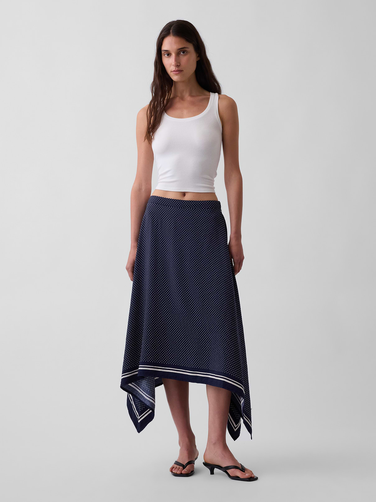 Image 1 of 5, Smooth rayon-nylon blend maxi skirt., Concealed zipper with hook-and-eye closure at side seam., Elasticized back waist., Assorted allover prints with a striped border at handkerchief hem., Product #909072
