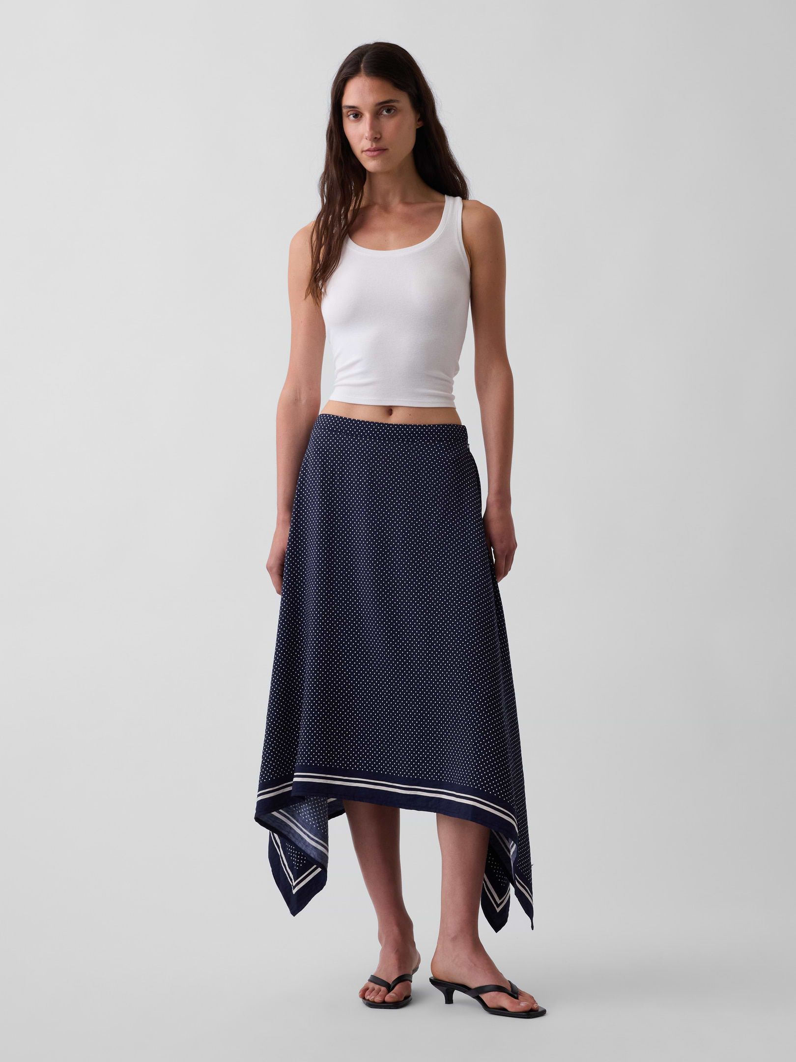 Image 1 of 5, Smooth rayon-nylon blend maxi skirt., Concealed zipper with hook-and-eye closure at side seam., Elasticized back waist., Assorted allover prints with a striped border at handkerchief hem., Product #909072