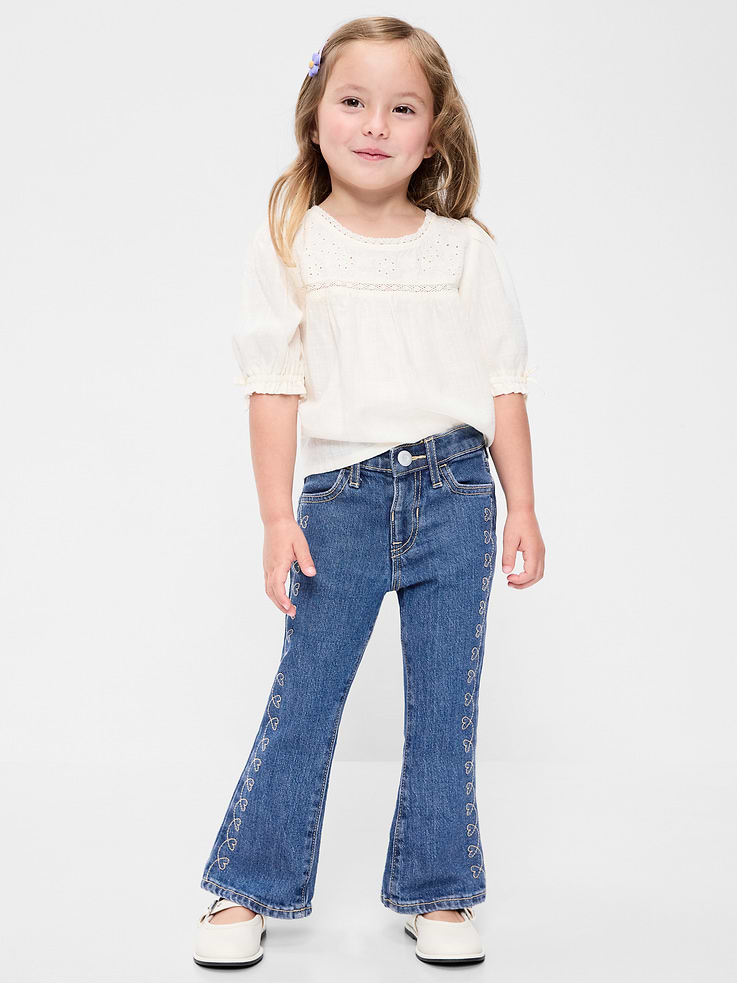 Image 1 of 5, interior adjustable waistband, elasticized waistband, faux fly, functional scoop pockets, functional patch pockets at back, flare leg, embroidered design along legs, Product #907778