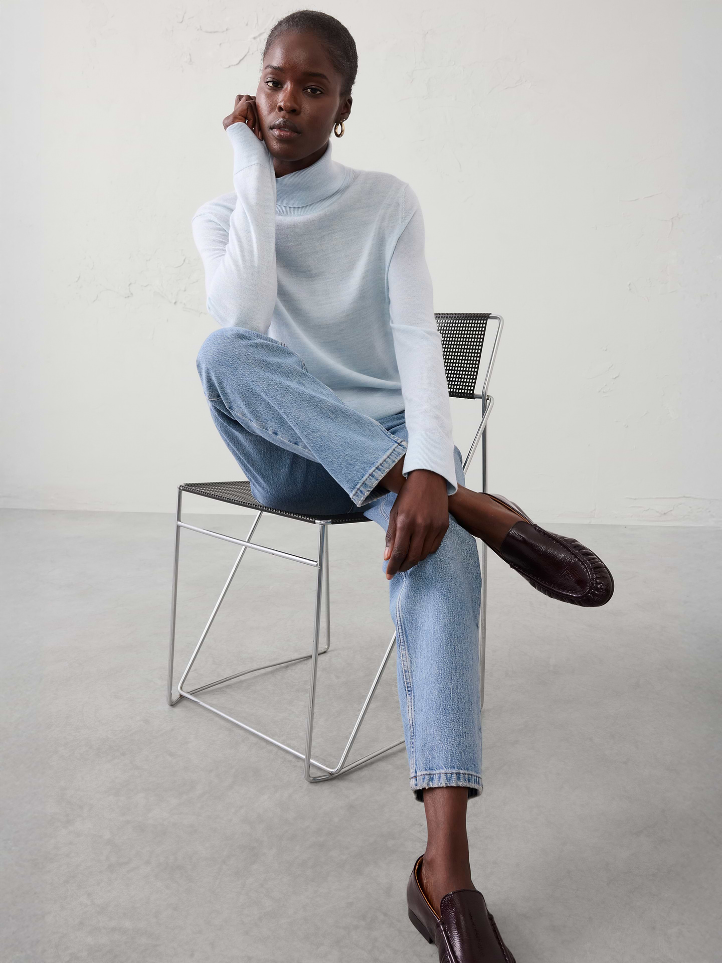 Image 1 of 4, Crafted from luxuriously soft Merino wool, this sweater offers lightweight warmth and natural breathability for all‑day comfort. Perfect for layering or wearing on its own, it delivers timeless versatility with an effortlessly refined finish., Turtleneck. Long sleeves., Ribbed neck, arm cuffs and hem., Straight hem., Made exclusively for Banana Republic Factory., Product #1176447
