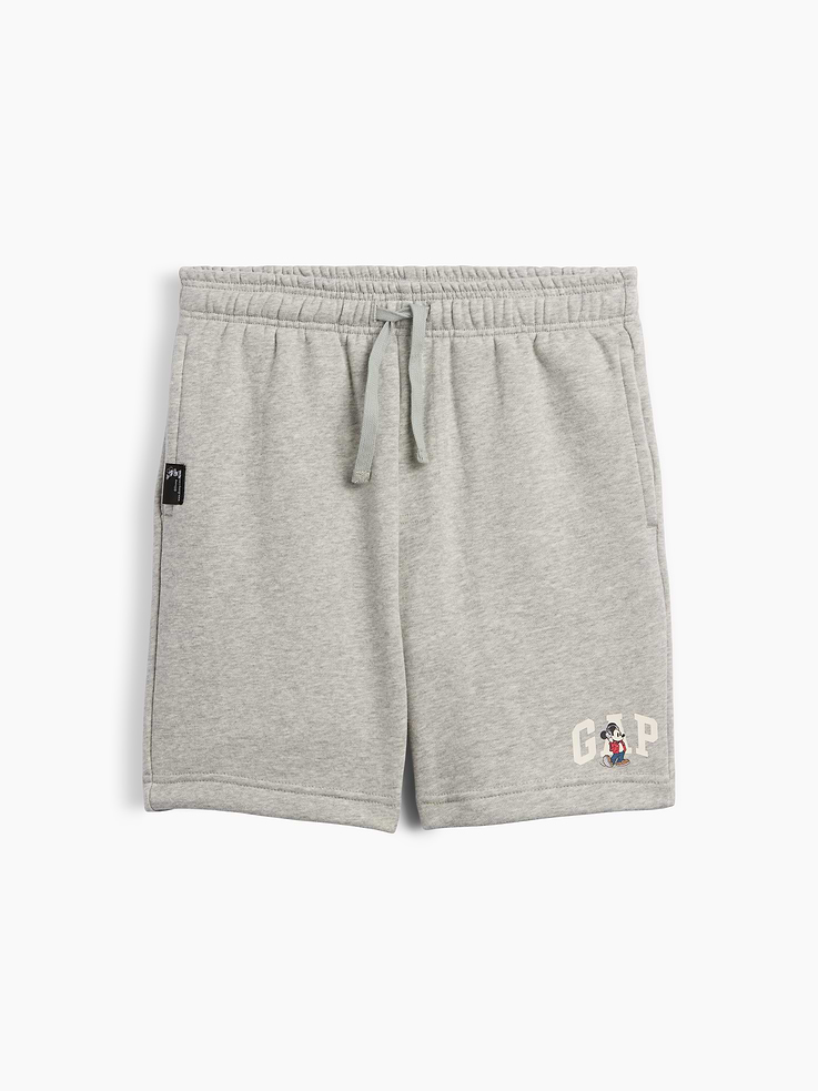 Image 1 of 3, A very special collaboration between Gap and Disney— two timeless, iconic American brands— led us to create a collection that celebrates Mickey Mouse and Minnie Mouse., This product is made with/contains 23% recycled polyester. Compared to virgin materials, using recycled materials helps reduce resource use and waste., Soft, comfy fleece., Drawcord ties at elasticized waist., On-seam pockets., Gap logo with Mickey Mouse graphic at hem., Product #1178830