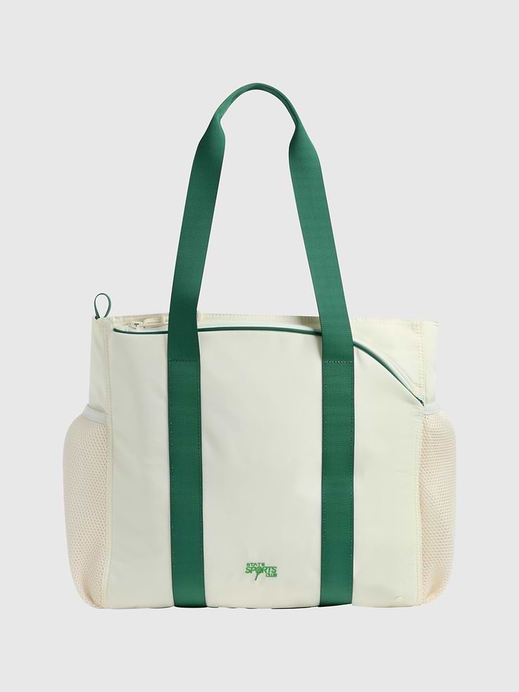 Image 1 of 4, STATE Sports Club, The tennis tote designed to elevate their game from the court to the playground., Perfect for practice, match day, and every adventure in between, this kids' tennis tote is as performance-driven as it is fun., 45% of this bag is made from recycled materials., For every bag sold, STATE donates a percentage of the proceeds to American families in need., STATE is the family bag company that’s carrying everyone, everywhere, through the journey of life with open hands.