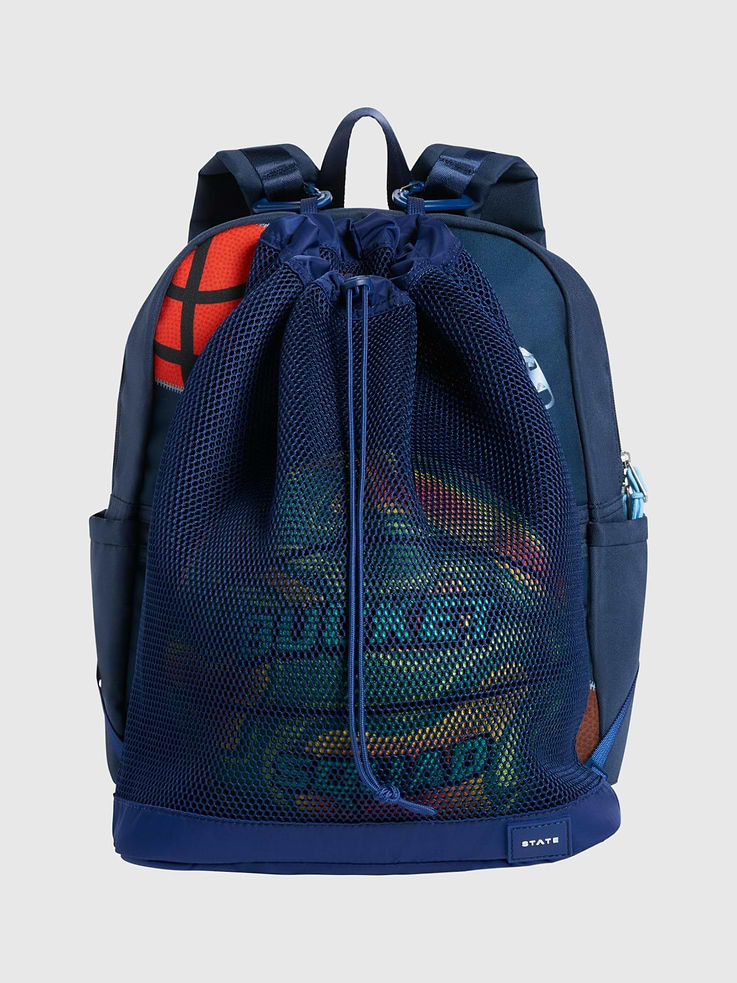 Image 1 of 2, STATE Sports Club, The perfect accessory to carry any sports ball, designed to clip onto any Kane backpack., Perfect for practice, game day, and every adventure in between, this kids' ball bag add-on is as practical as it is fun., For every bag sold, STATE donates a percentage of the proceeds to American families in need., STATE is the family bag company that’s carrying everyone, everywhere, through the journey of life with open hands.
