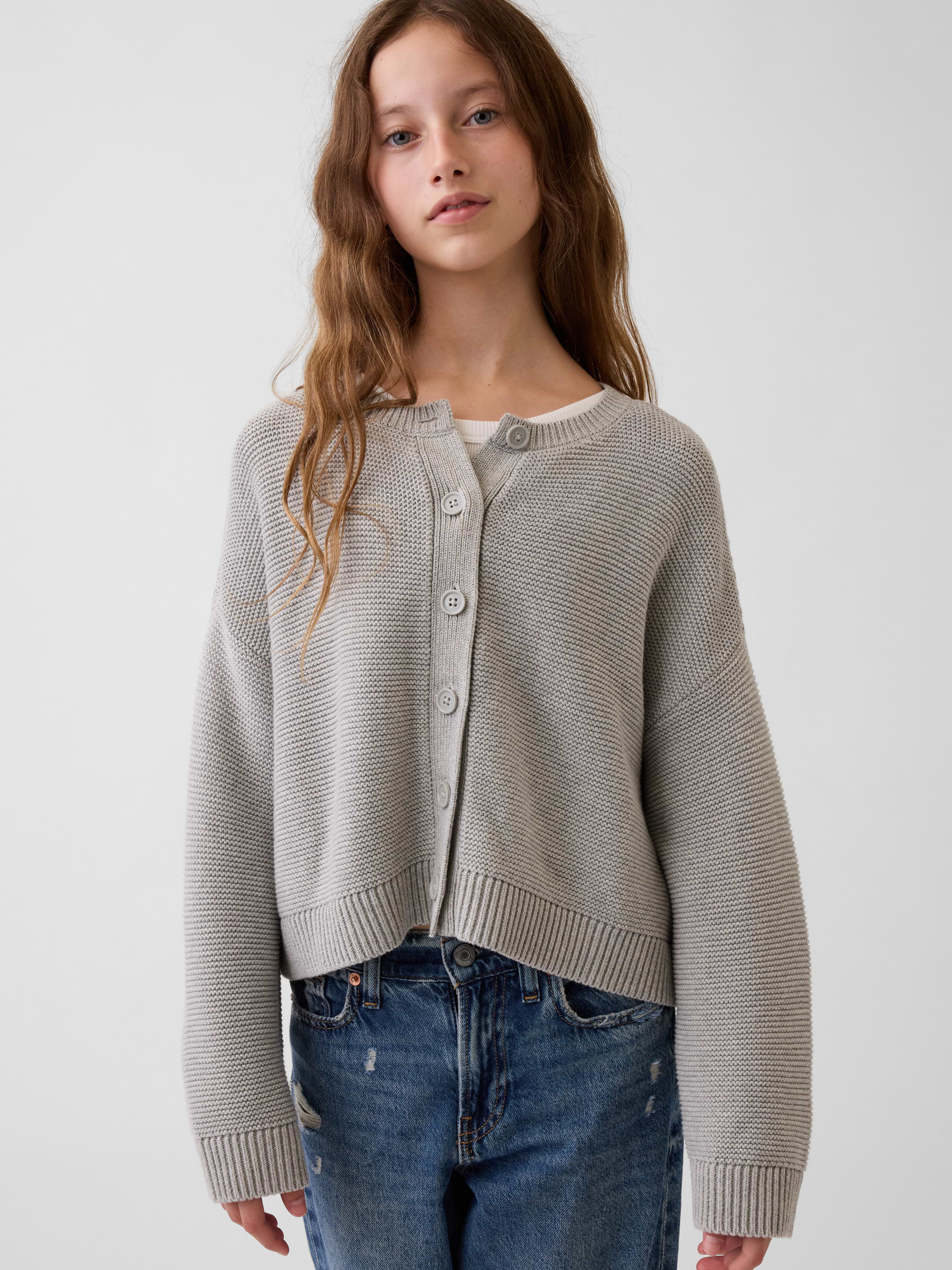 Image 1 of 5, Soft knit cotton boxy cardigan sweater. In an oversized fit., Crewneck., Long sleeves with drop shoulders., Button front., Ribbed cuffs and hem., Certain styles have allover stripes., Product #908922