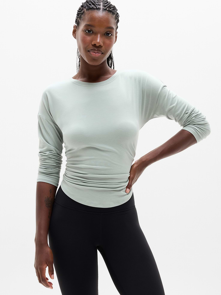 Image 1 of 7, FOR: Yoga or studio practice, FEEL: Soft, premium-weight comfort with luxurious TENCEL™ fibers that drape beautifully, FAVE: Your favorite studio top, modernized for more ease. Same premium-weight fabric, now with added front coverage and a minimal, clean back seam., Product #784678