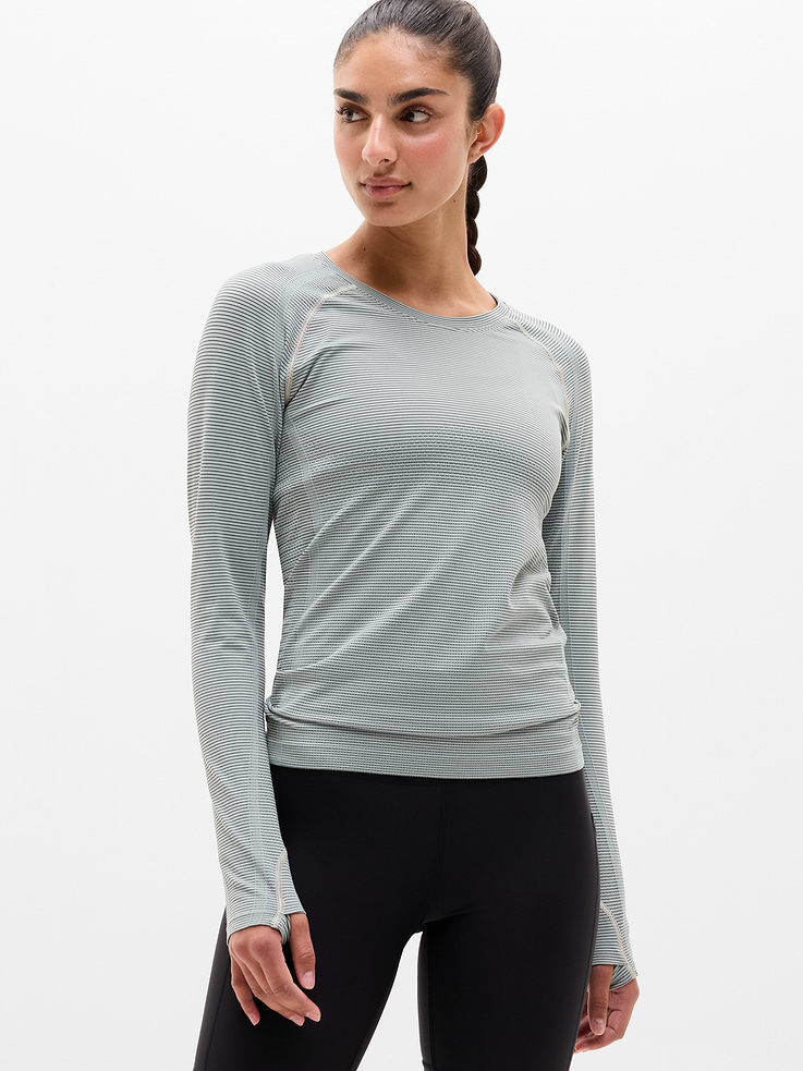 Image 1 of 8, FOR: Medium to high-impact workouts at the gym, studio, or outdoors, FEEL: Enhanced yarns deliver soft stretch and quick recovery, keeping you comfortable while you push your limits, FAVE: The workout top you love, now with upgraded stretch, sweat-wicking power, and sleek style, Seamless construction for minimal chafing, Functional mesh panels allow for optimal movement and breathability, Thumbholes lock your fit in place, Product #1177319