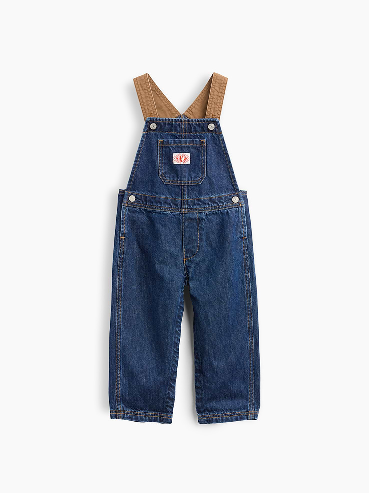 Image 1 of 3, Authentic, non-stretch denim workwear overalls., Square neck., Canvas tank straps with adjustable inner button closures at front., Chest bib pocket with Gap Work Wear logo patch., Functional snap button closure at sides., Back patch pockets., Snaps at inseam for easy dressing and diapering., Responsibly Made: This pair of overalls is part of our water-saving Washwell program. Compared with conventional wash methods, Washwell uses at least 20% less water., More Sustainable Cotton: Made with 5% recycled cotton. Compared to virgin materials, using recycled materials helps reduce resource use and waste., Product #912550