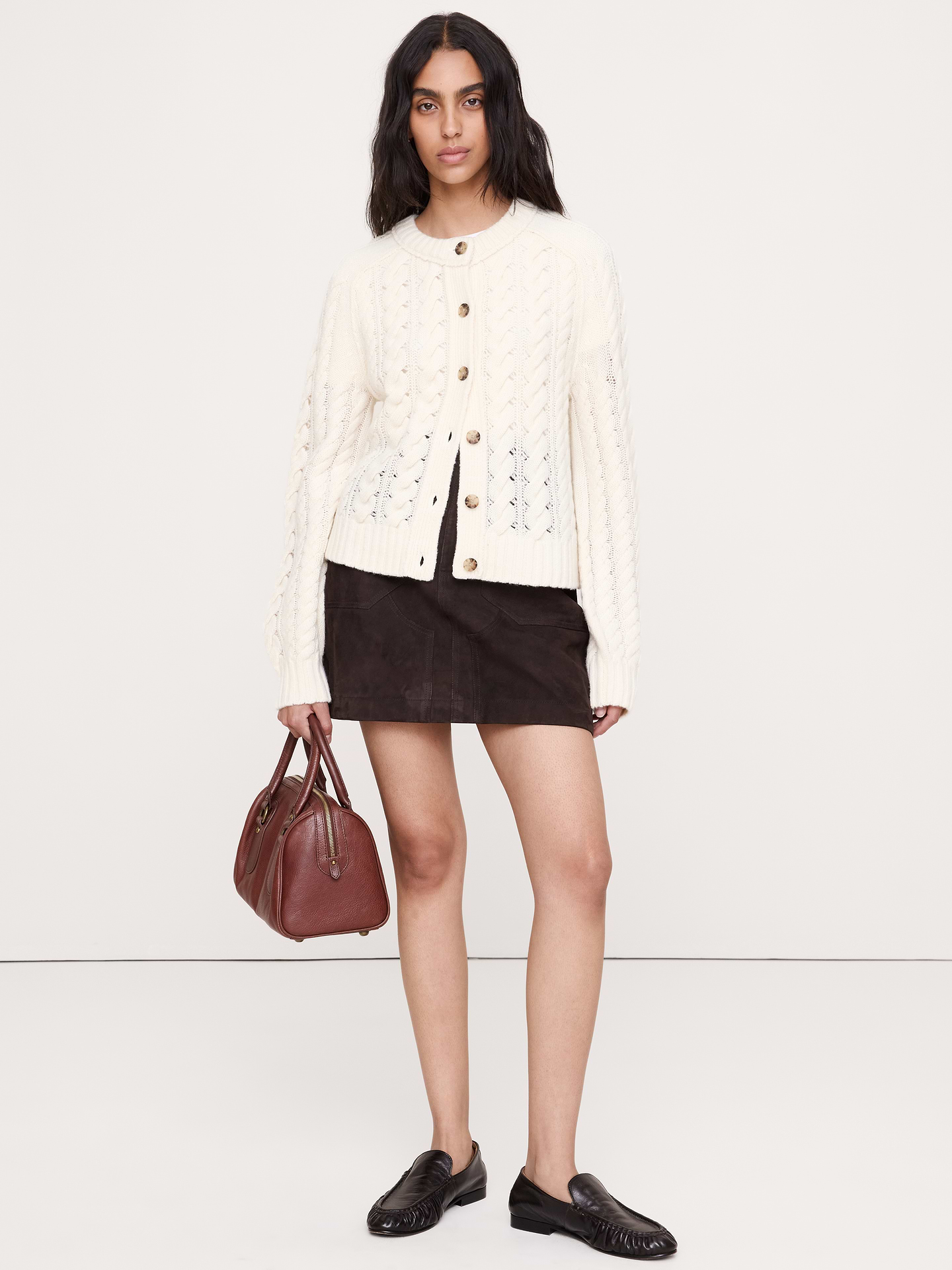 Image 1 of 7, This soft cable-knit cardigan brings together warm Merino and Yak wool using a drop-needle technique for a cozy, not-too-casual look., Relaxed Fit: A straight & roomy fit., Crew neck with button closure., Balloon sleeves., Straight hem., Product #1180221