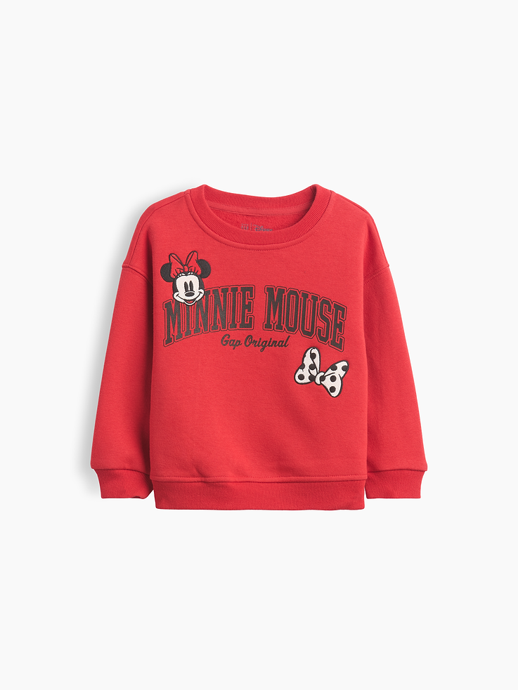 Image 1 of 2, Soft cotton-blend fleece pullover sweatshirt., Crewneck., Long sleeves with drop shoulders., Disney Minnie Mouse graphics at front., Banded rib cuffs and hem., Made with 52% Protocol cotton verified by the U.S. Cotton Trust Protocol, a program which works with farms committed to improving their environmental footprint by minimizing water usage and improving soil health (Claim No. 10127)., Made with 23% recycled polyester. Compared to virgin materials, using recycled materials helps reduce resource use and waste., Product #912879