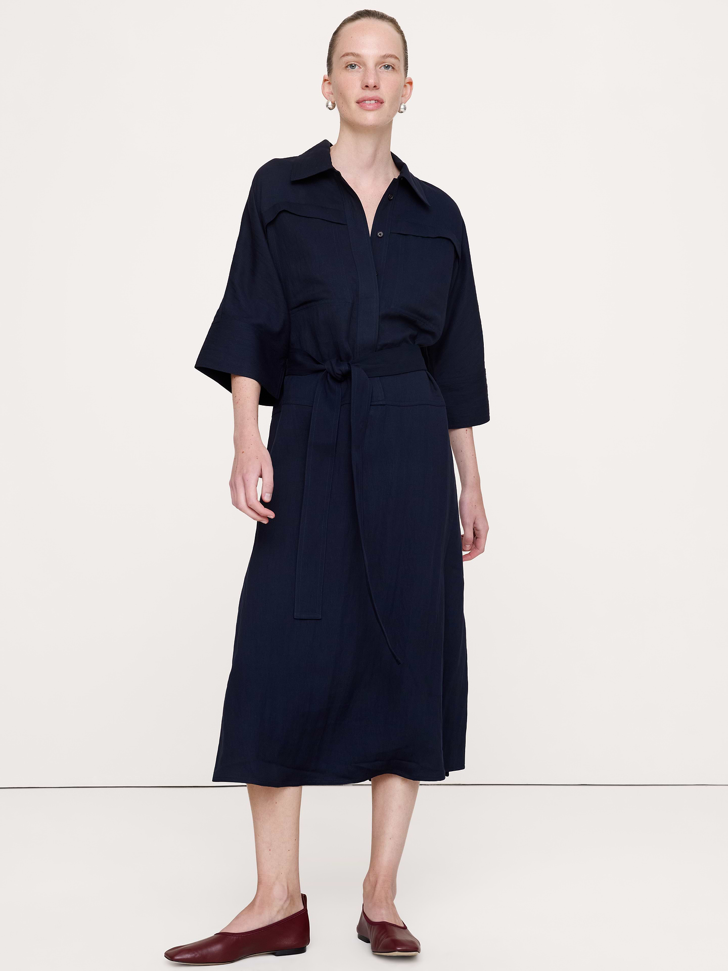 Image 1 of 4, Our drapey twill gives this midi shirt dress a polished feel without sacrificing an ounce of comfort., Fit & Flare: Relaxed through chest and shoulders, fitted waist with a flare skirt., Point collar with a button-front closure., Tie waist., Side pockets., Unlined., Product #1180137