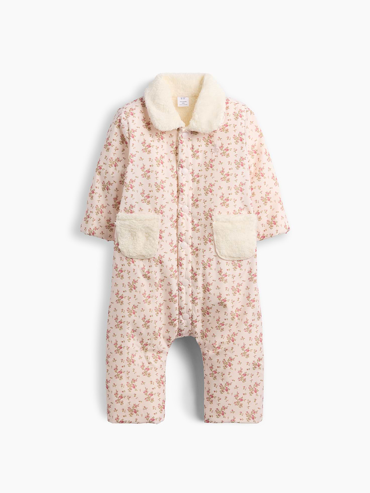 Image 1 of 3, Water and wind-resistant coated baby one-piece with a cozy sherpa lining., Sherpa spread collar., Long sleeves., Snap button front., Sherpa patch pockets at front., Hidden snaps at inseam for easy dressing and diapering., Allover floral print., Sherpa lined., Outer shell made with 100% recycled polyester. Compared to virgin materials, using recycled materials helps reduce resource use and waste., Product #913889