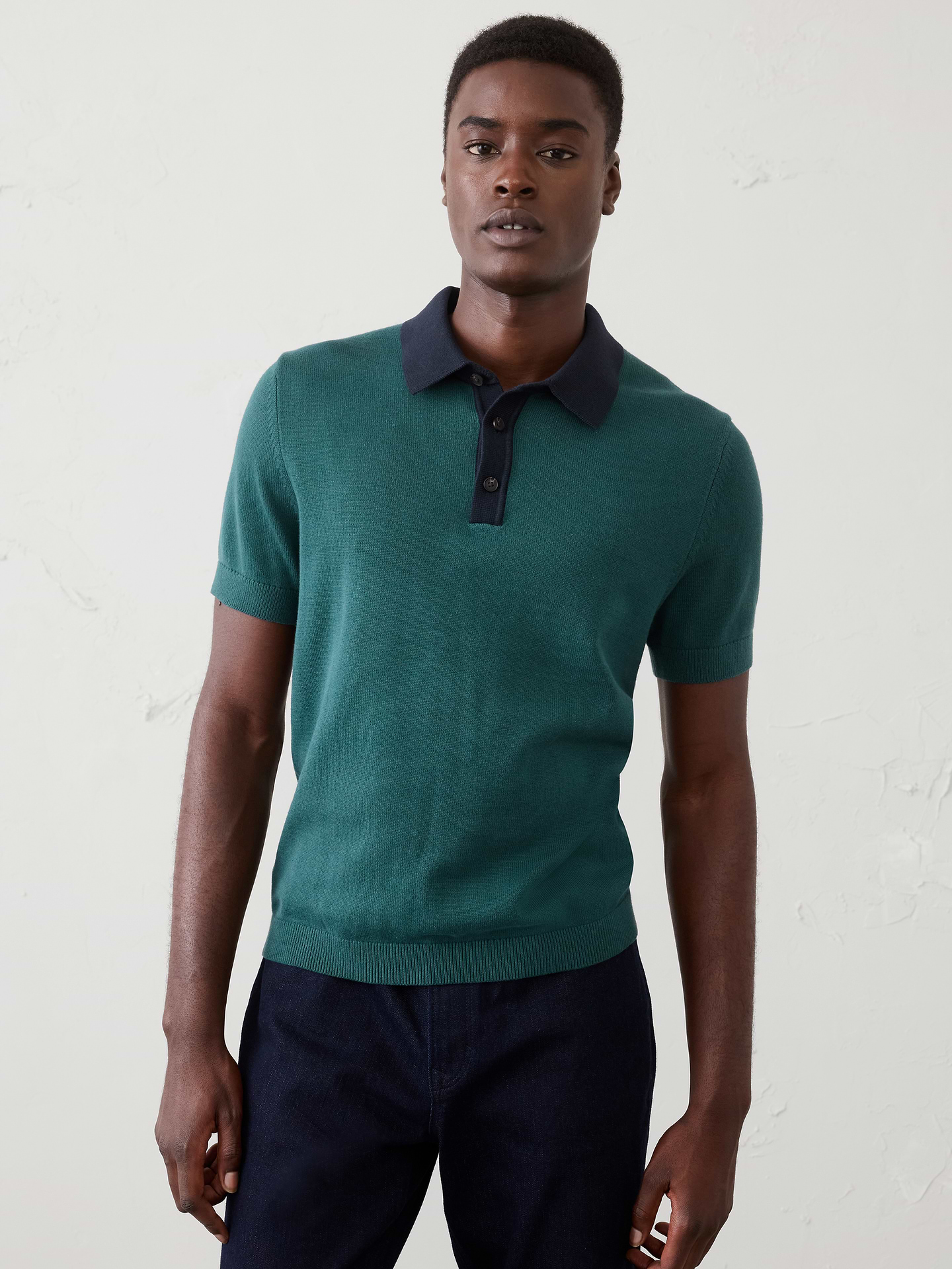 Image 1 of 4, Made from 100% cotton, this sweater polo features a traditional placket for versatile styling. Each color is finished with a tonal contrast collar, adding a subtle point of distinction to this everyday essential., Polo collar with button placket. Short sleeves., Ribbed arm cuffs and hem., Made exclusively for Banana Republic Factory., Product #1175520