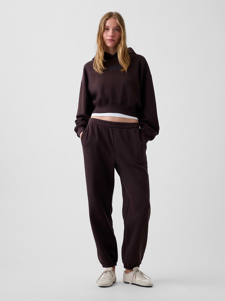 Image 1 of 6, Our softer than soft sweats. Brushed on the inside. Smooth on the outside. Made so that no two are alike., Soft cotton-blend fleece joggers in a relaxed fit., Elasticized waist with inner drawcords., Side on-seam pockets., Elasticized cuffs., Made with 23% recycled polyester. Compared to virgin materials, using recycled materials helps reduce resource use and waste., Explore our GapSweats Guide ., Product #903064