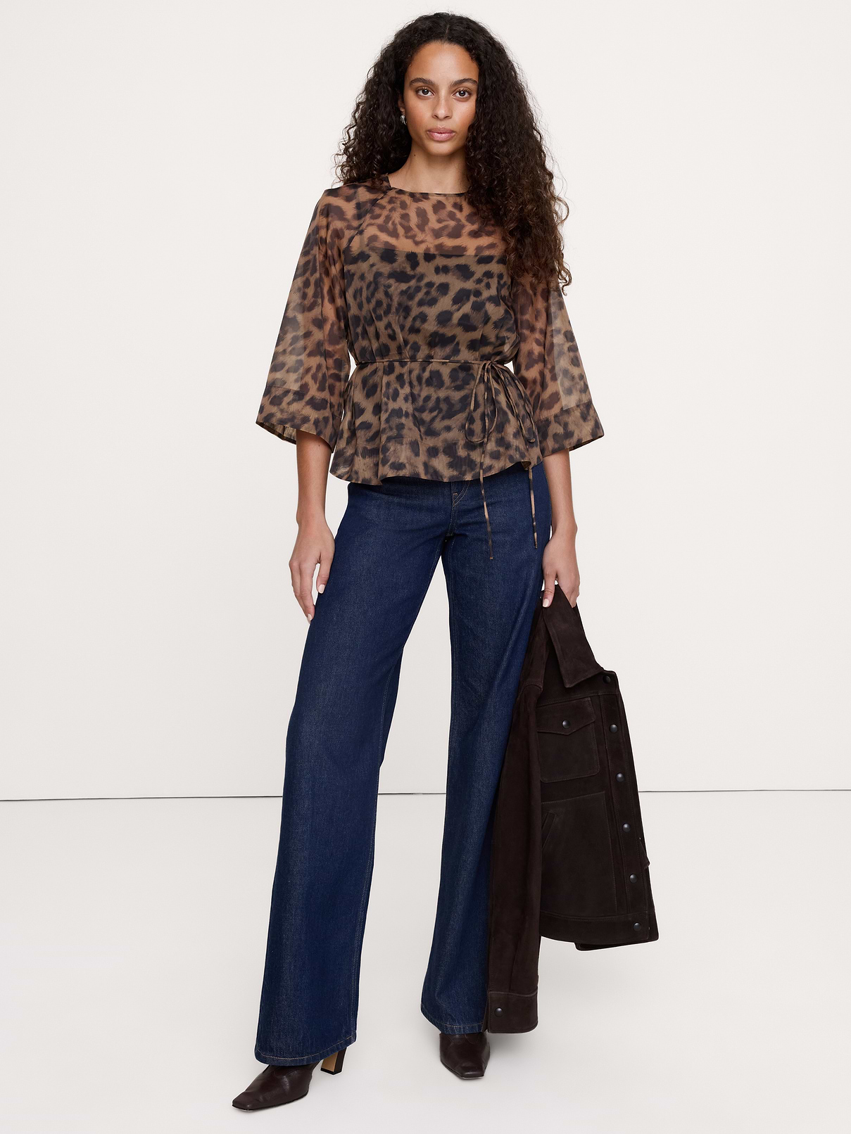 Image 1 of 4, Our flowy peplum top is cut from lightweight and breathable organza with just enough structure to hold its shape beautifully. Sheer., Fit & Flare: Fitted through the chest, shoulders, and waist with a flare skirt., Crew neck with button-keyhole at back., Unlined., Product #1181560
