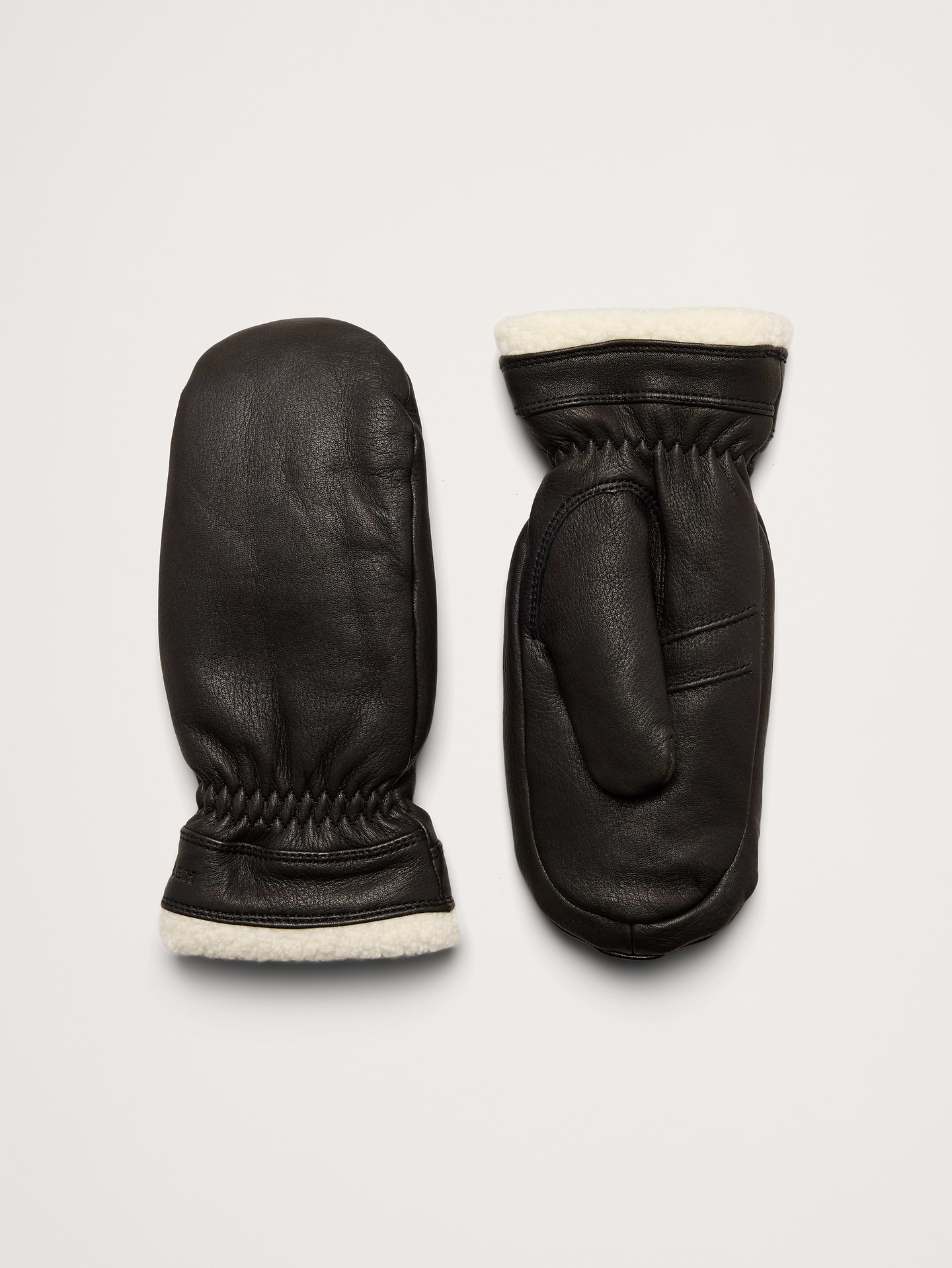 Image 1 of 2, A country mitten, the Elle Mitt features a cable knit wool backhand that is both cute and warm. Nappa leather palm for durability and PrimaLoft Gold Insulation for added warmth., Hestra: Family-run since 1936, crafting high-quality gloves in Sweden for all hand—from lumberjacks to skiers and now to you., Fleece lining., Product #1180434