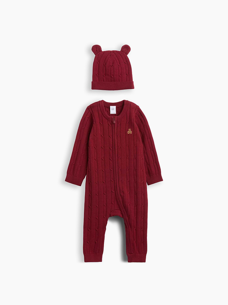 Image 1 of 2, Soft cable-knit hat and sweater one-piece outfit set., Crewneck, zipper front., Long sleeves., Embroidered Brannan Bear at chest., Ribbed cuffs., Matching beanie hat with bear ear appliques at top., This product was made in a factory that invests in gender equity and women’s empowerment through RISE. Learn more at gapinc.com/equity ., Product #1185439