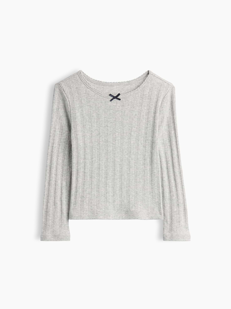 Image 1 of 2, Soft ribbed pointelle-knit cotton T-shirt., Round neckline with scalloped edge and tacked satin ribbon bow., Long sleeves., Certain styles have an allover print., Product #913034