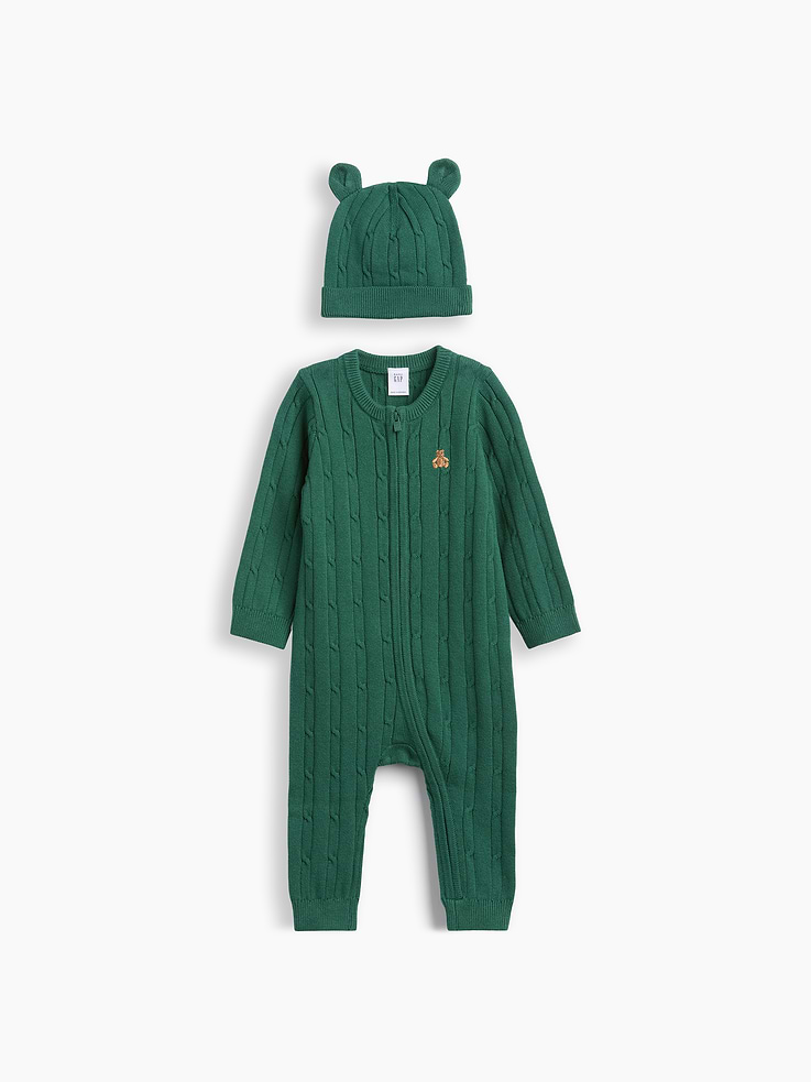 Image 1 of 2, Soft cable-knit hat and sweater one-piece outfit set., Crewneck, zipper front., Long sleeves., Embroidered Brannan Bear at chest., Ribbed cuffs., Matching beanie hat with bear ear appliques at top., This product was made in a factory that invests in gender equity and women’s empowerment through RISE. Learn more at gapinc.com/equity ., Product #1185439