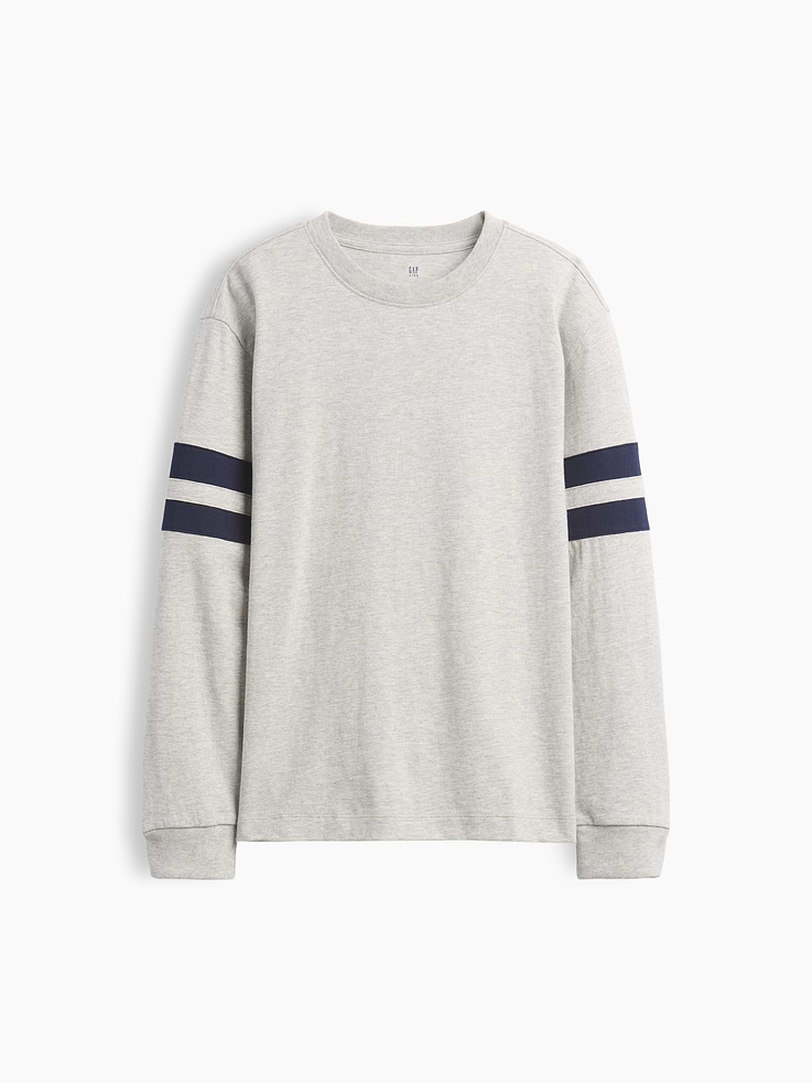 Image 1 of 3, Soft cotton jersey T-shirt. In a relaxed fit., Crewneck., Long sleeves with drop shoulders and banded cuffs., Varsity-style double stripes at sleeves., This product was made in a factory that invests in gender equity and women’s empowerment through RISE. Learn more at gapinc.com/equity ., Product #1184270