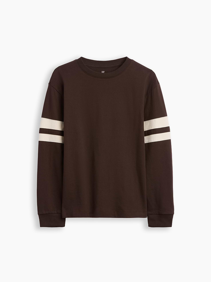 Image 1 of 3, Soft cotton jersey T-shirt. In a relaxed fit., Crewneck., Long sleeves with drop shoulders and banded cuffs., Varsity-style double stripes at sleeves., This product was made in a factory that invests in gender equity and women’s empowerment through RISE. Learn more at gapinc.com/equity ., Product #1184270