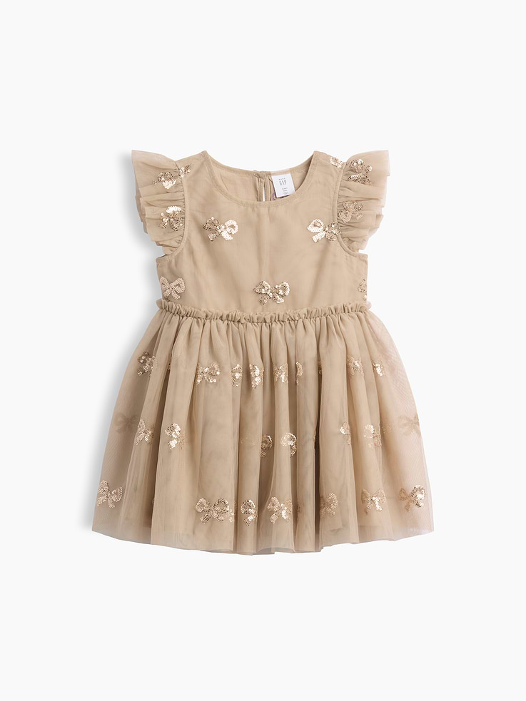 Image 1 de 2, Filet en tulle avec doublure en coton doux., Encolure arrondie avec fermeture goutte d’eau et bouton au dos., Manches flottantes., Bordure à volants et fronces à la taille., Jupe en tulle superposée., Boucles à paillettes sur l’ensemble., Produit #1183433