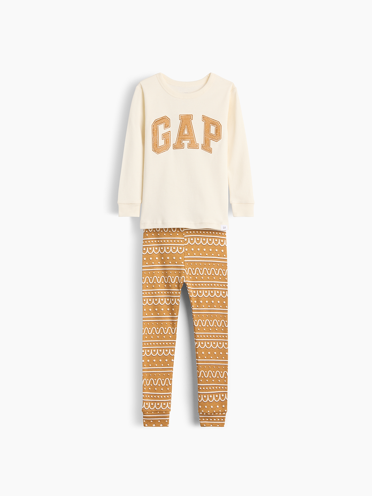 Image 1 of 2, Our comfiest PJs—now softer than ever. Cozy brushed cotton on the inside. All their favorite prints & colors on the outside., Soft cotton jersey pajama top and pants PJ set with a cozy brushed interior., Crewneck., Long sleeves., Elasticized waist at PJ pant., Banded cuffs., Gap gingerbread logo at top, matching gingerbread print at pants., Made with 100% organically grown cotton, which is grown without the use of synthetic pesticides and fertilizers., Product #1186425