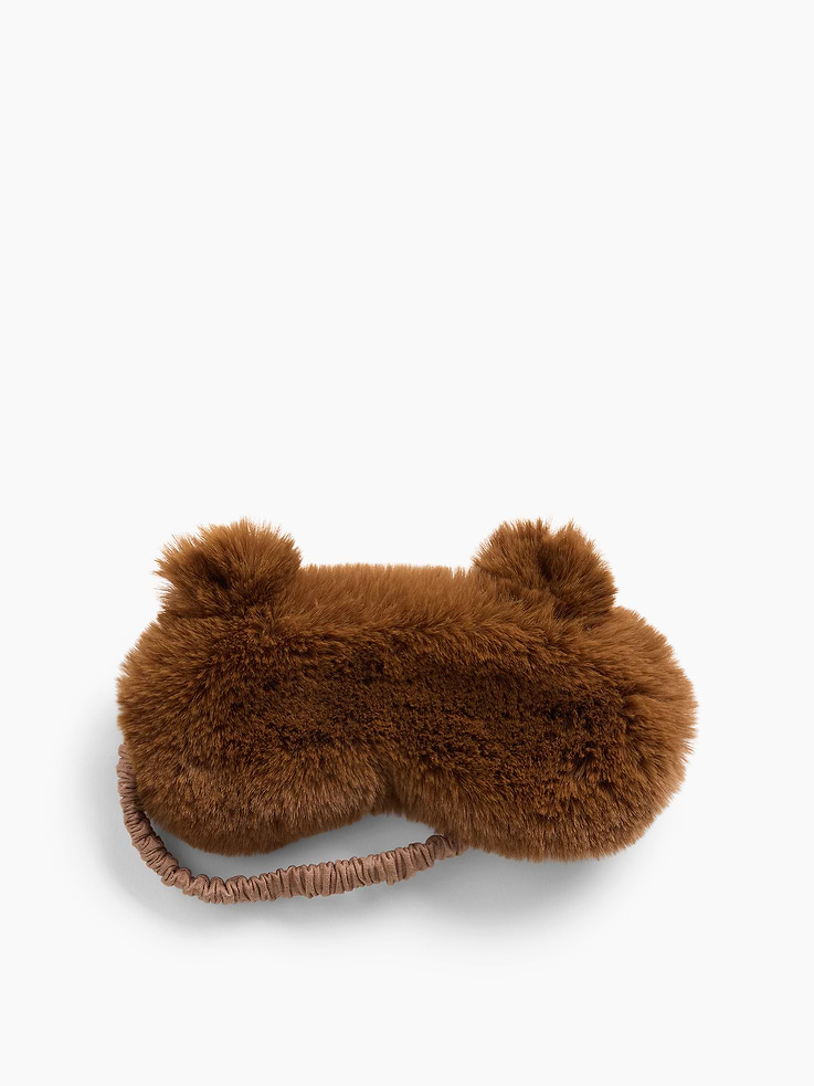 Image 1 of 2, Soft faux fur sleep mask., Bear ear appliques at top., Elasticized back strap., This product was made in a factory that invests in gender equity and women’s empowerment through RISE. Learn more at gapinc.com/equity ., Product #1185358