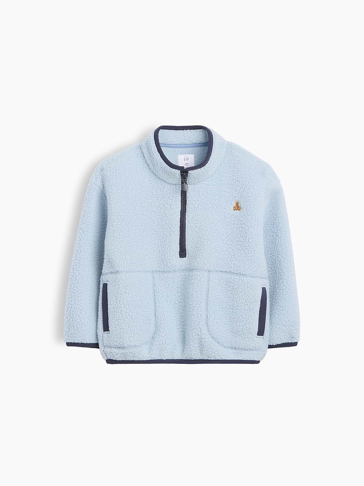 Image 1 of 2, Soft sherpa pullover., Mock neck with half-zip closure., Long sleeves with drop shoulders., Embroidered Brannan Bear at chest., Front welt pockets., Contrast binding detail., Made with 25% recycled polyester. Compared to virgin materials, using recycled materials helps reduce resource use and waste., This product was made in a factory that invests in gender equity and women’s empowerment through RISE. Learn more at gapinc.com/equity ., Product #1184942
