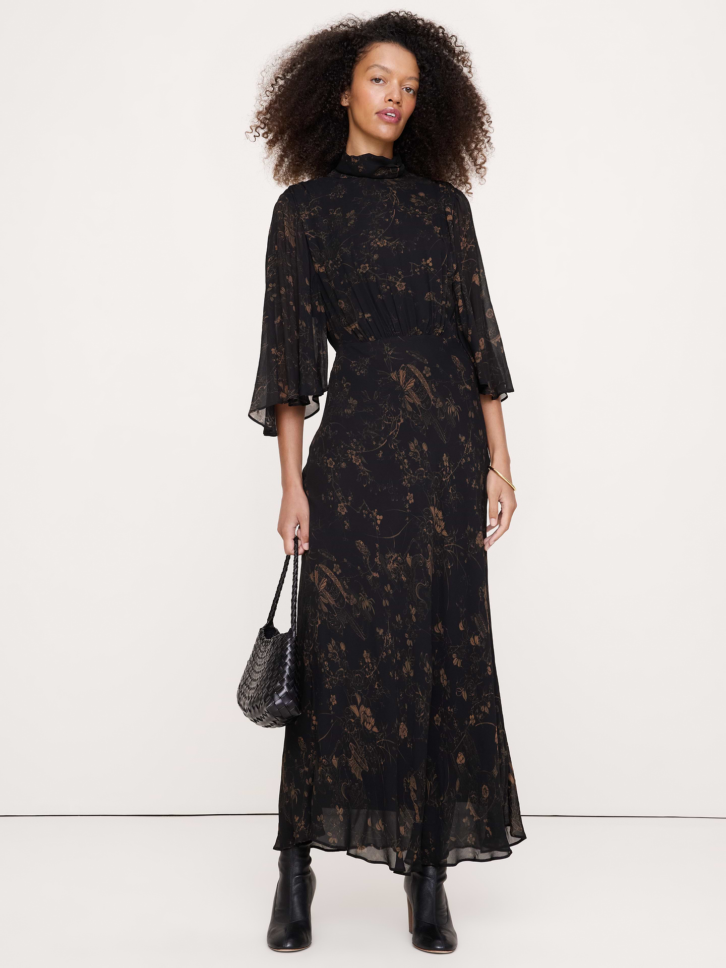 Image 1 of 7, Instantly romantic, we cut this flowy dress from soft, light-as-chiffon georgette and opted for flutter cape sleeves and a relaxed silhouette., Blouson fit: Relaxed through chest and shoulders, defined waist with a flare skirt., Mock neck with 3-button keyhole closure at back., Bra-friendly design., Lined., Product #1180147