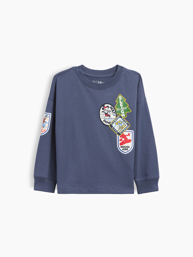 Image 1 of 2, Characters for your little characters. Making every day more special., Soft cotton jersey graphic T-shirt., Crewneck., Long sleeves with drop shoulders and banded cuffs., Disney character graphics at front, back, and sleeve., Made with 60% Protocol cotton verified by the U.S. Cotton Trust Protocol, a program which works with farms committed to improving their environmental footprint by minimizing water usage and improving soil health (Claim No. 10127)., Product #915312