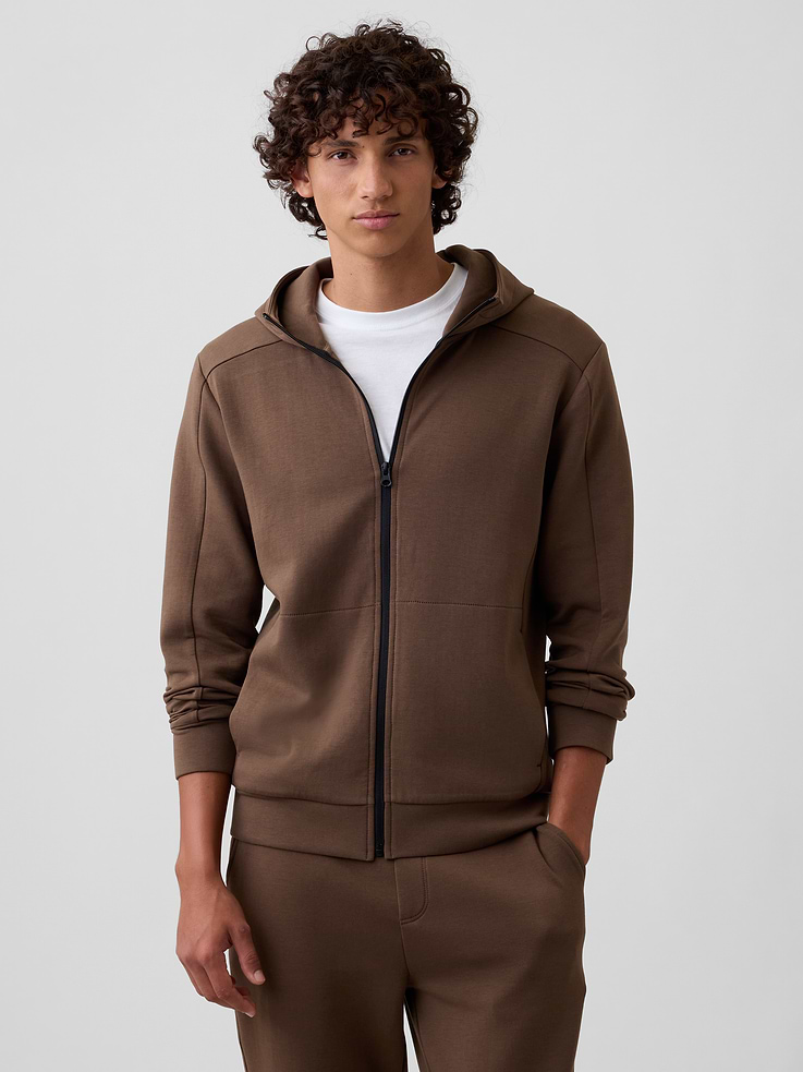 Image 1 of 4, Breathable fleece knit with stretch., Long sleeves with banded cuffs., Hood, zip front., On-seam pockets., Banded hem., This product was made in a factory that invests in gender equity and women’s empowerment through RISE. Learn more at, Product #626282