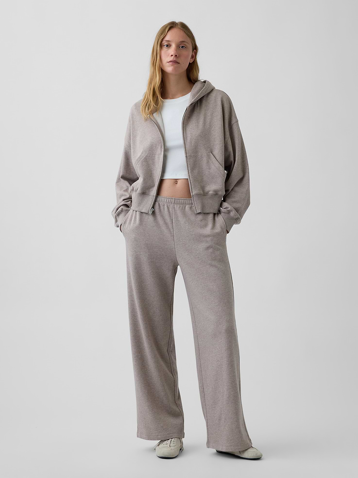 Image 1 of 6, Our signature softer than soft sweats — now in a light French Terry. Brushed outside. Textured inside. Feels better than vintage, from day one., Soft cotton-blend French terry loose sweatpants. In a relaxed fit with a wide leg., Elasticized waist with inner drawcords., Side on-seam pockets., Made with 52% Protocol cotton verified by the U.S. Cotton Trust Protocol, a program which works with farms committed to improving their environmental footprint by minimizing water usage and improving soil health (Claim No. 10127)., Made with 23% recycled polyester. Compared to virgin materials, using recycled materials helps reduce resource use and waste., Explore our GapSweats Guide ., Product #1185405