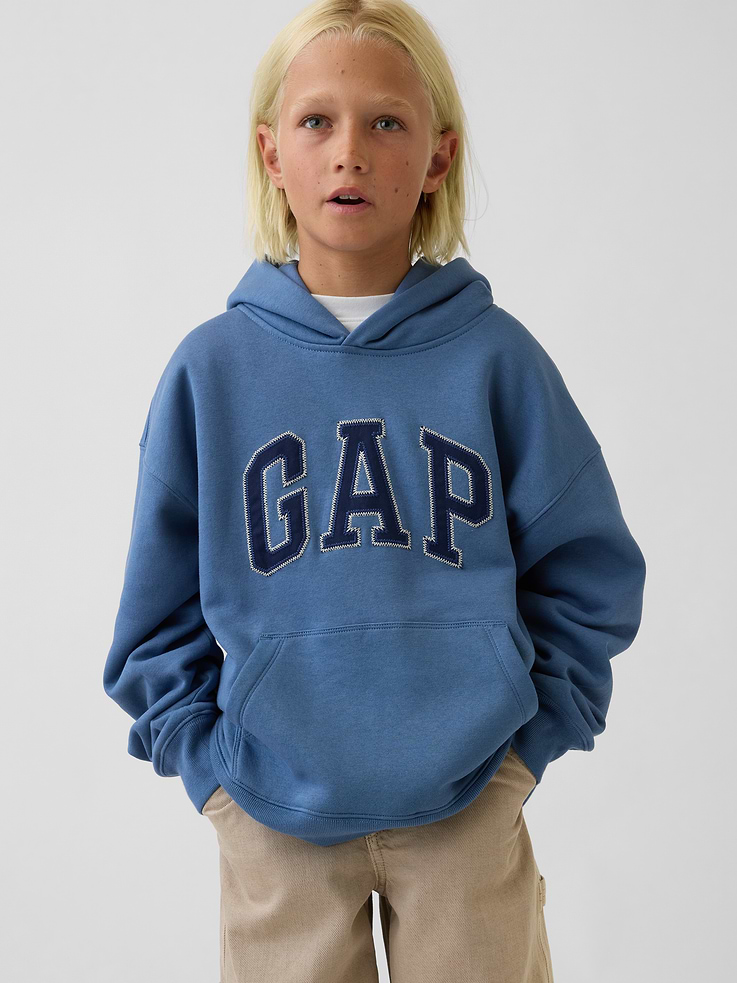 Image 1 of 4, Our softer than soft sweats. Brushed on the inside. Smooth on the outside. Made so that no two are alike., Soft cotton-blend fleece hoodie. In an oversized fit., Hooded neckline., Long sleeves with drop shoulders., Gap logo at front., Kanga pocket., Banded rib cuffs and hem., Made with 52% Protocol cotton verified by the U.S. Cotton Trust Protocol, a program which works with farms committed to improving their environmental footprint by minimizing water usage and improving soil health (Claim No. 10127)., Made with 23% recycled polyester. Compared to virgin materials, using recycled materials helps reduce resource use and waste., Product #1182594