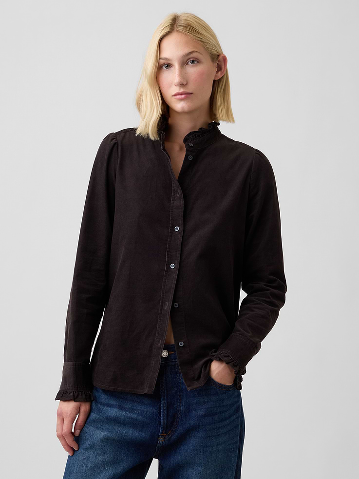 Image 1 of 5, Smooth corduroy weave., Long sleeves with ruffle trim at button cuffs., Ruffle trim at round neckline, button front., Curved shirttail hem., Product #1178551