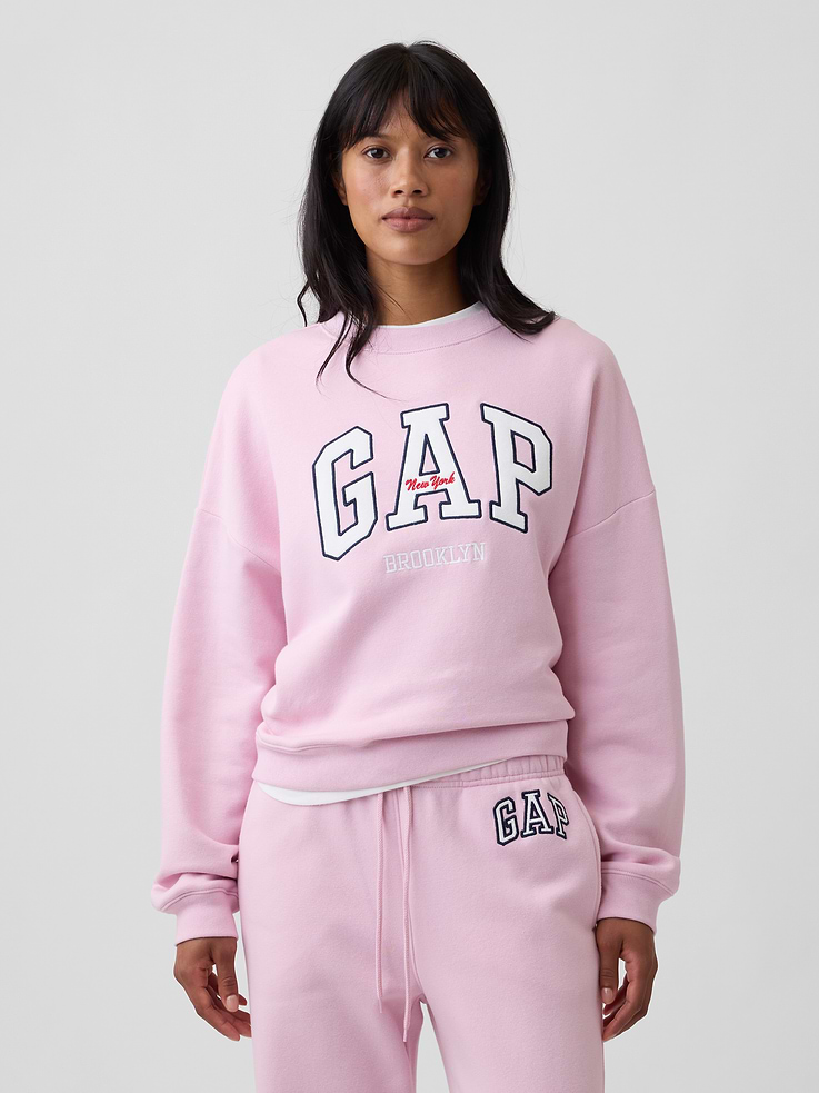 Image 1 of 5, This product is made with/contains 23% recycled polyester. Compared to virgin materials, using recycled materials helps reduce resource use and waste., Soft, comfy fleece., Dropped shoulder, long sleeves with banded cuffs., Crewneck., Graphic at front., Banded wedge hem., Product #1182535