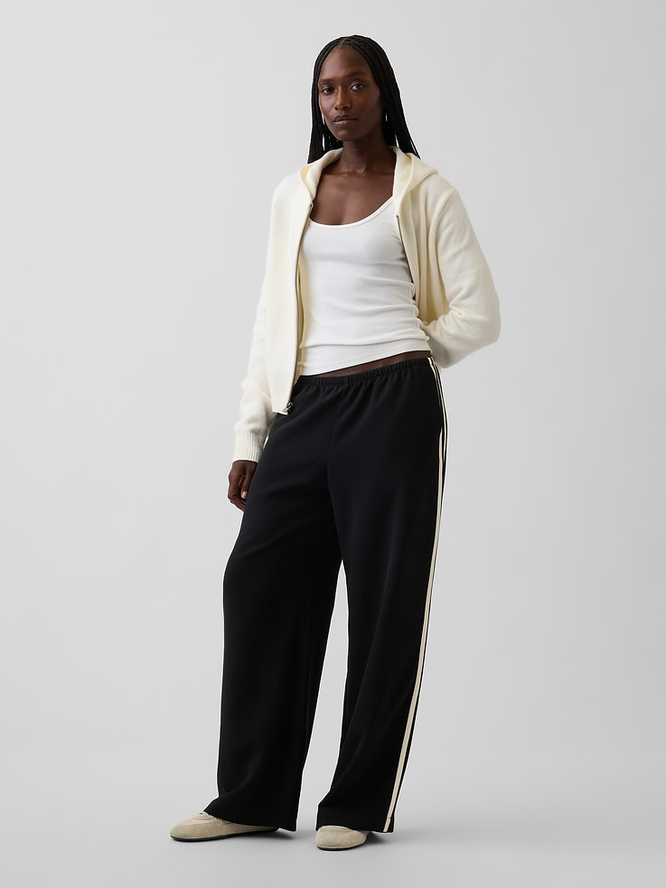 Image 1 of 7, Soft, stretch twill easy wide-leg pants., Elasticized waist with inner drawcords., Side pockets., Made with 57% recycled polyester. Compared to virgin materials, using recycled materials helps reduce resource use and waste., This product was made in a factory that invests in gender equity and women’s empowerment through RISE. Learn more at gapinc.com/equity ., Product #818696
