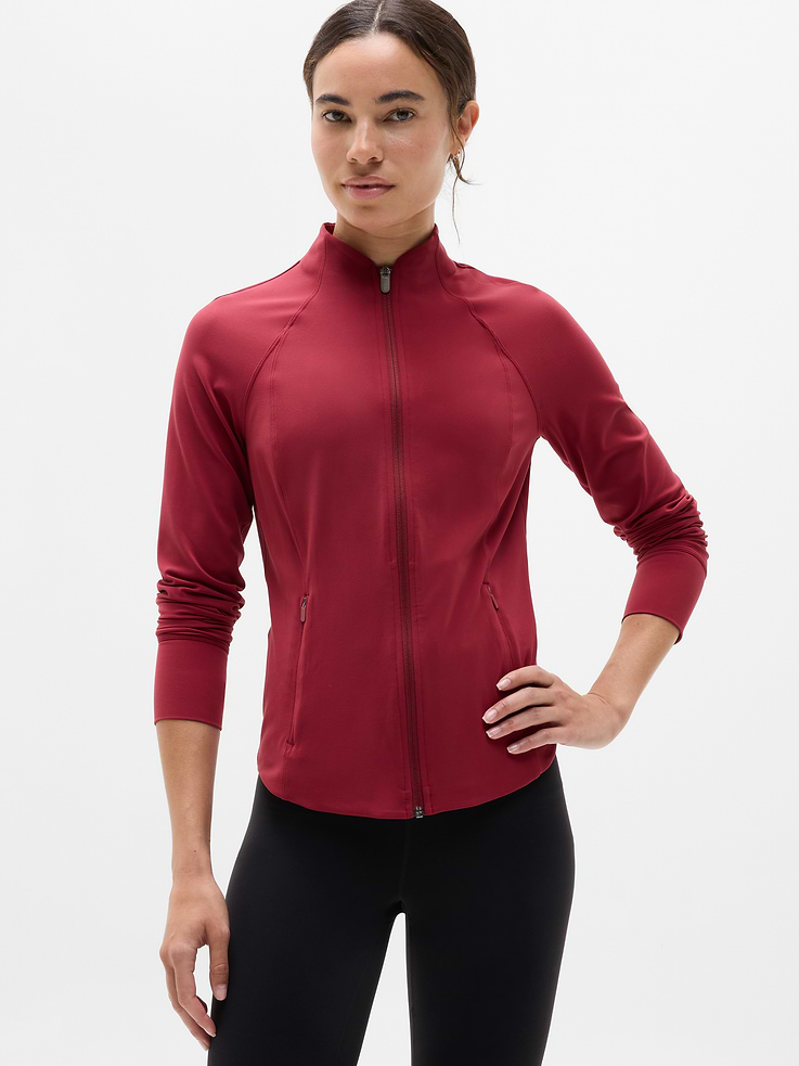 Image 1 of 5, FOR: Layering up to and from your workout, FEEL: Powervita fabric is buttery soft with support that feels like a gentle hug, FAVE: Thumbholes that keep your sleeves in place, Side zip pockets secure your essentials, Product #657490