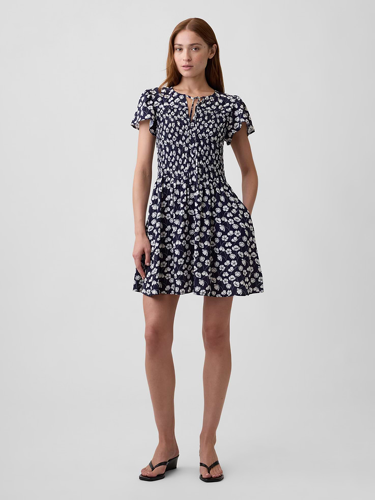 Image 1 of 6, Smooth weave., Short flutter sleeves., Drawcord ties at split neckline., Smocking and shirring at yoke., Select styles have allover print., Product #1182566