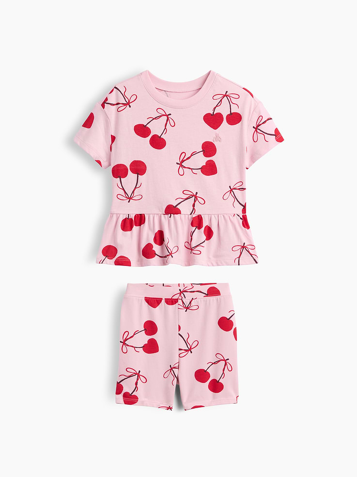 Image 1 of 3, Soft cotton top with stretch jersey bike shorts., Dropped shoulder, short sleeves., Crewneck., Shirring at peplum hem., Elasticized waist., Allover print., Product #1187812
