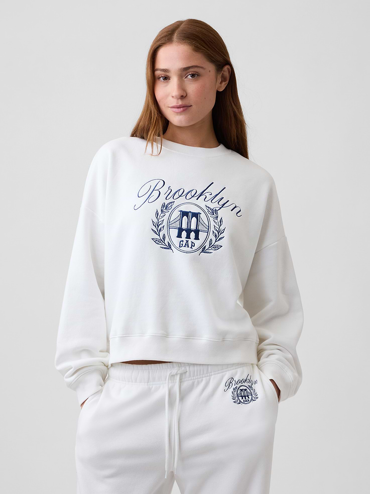 Image 1 of 5, This product is made with/contains 23% recycled polyester. Compared to virgin materials, using recycled materials helps reduce resource use and waste., Soft, comfy fleece., Dropped shoulder, long sleeves with banded cuffs., Crewneck., Graphic at front., Banded wedge hem., Product #1182535