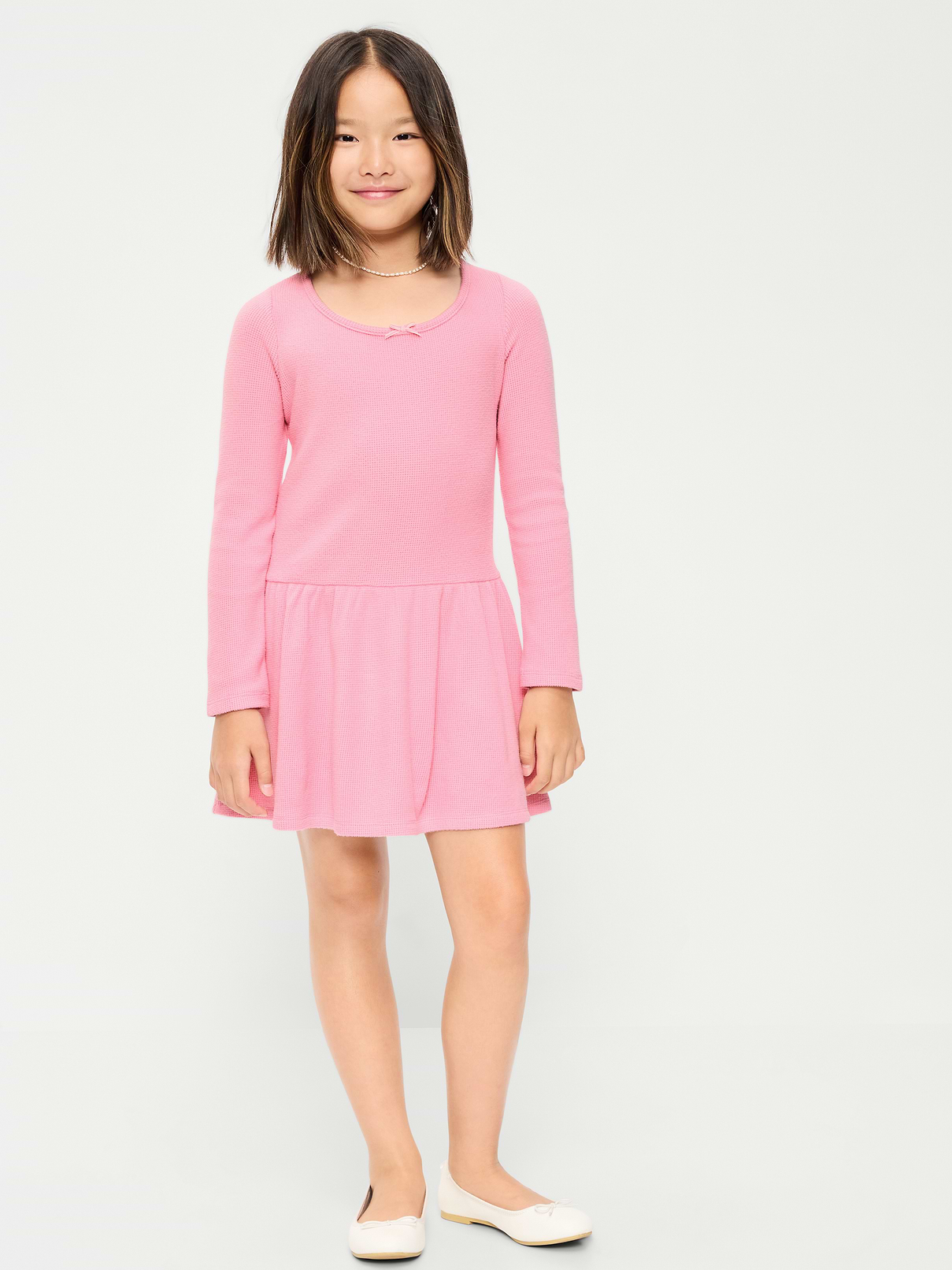 Image 1 of 4, scoop neckline, long sleeves, decorative bow at neckline, drop waist, full skirt, Product #909463