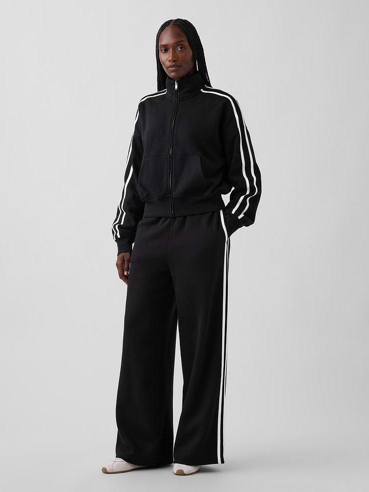 Image 1 of 6, Soft cotton-blend fleece baggy sweatpants. In a relaxed fit., Elasticized waist with inner drawcords., Side on-seam pockets., Taped double side stripes., Made with 52% Protocol cotton verified by the U.S. Cotton Trust Protocol, a program which works with farms committed to improving their environmental footprint by minimizing water usage and improving soil health (Claim No. 10127)., Made with 23% recycled polyester. Compared to virgin materials, using recycled materials helps reduce resource use and waste., Product #1188257
